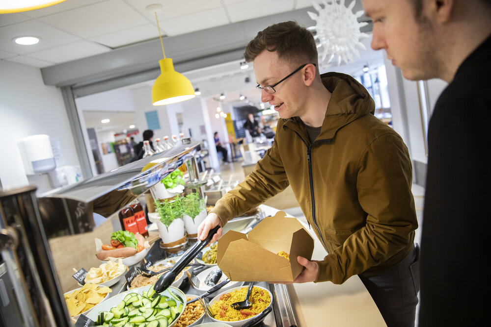 Students buying food in Maxwell Building café