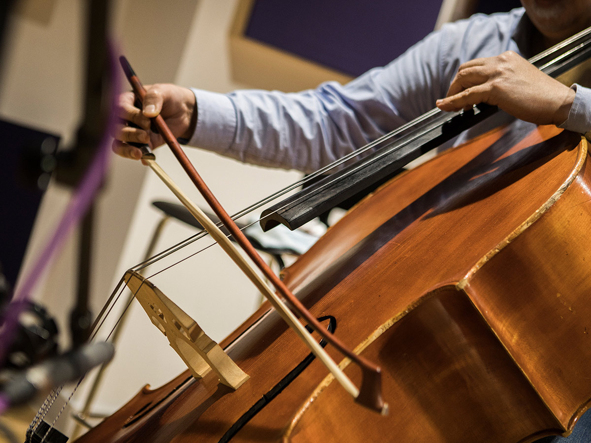 A cellist playing their cello