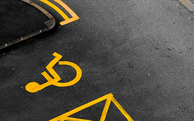 Car parking with double yellows and disabled sign