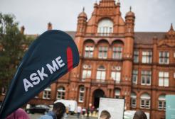 University of Salford Peel building and 'ask me' sign.