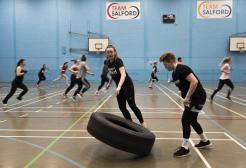 Students exercising in the Sports Centre sports hall