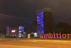 Maxwell Building at night with ambition sign