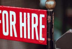 a sign shows the word 'Hire'