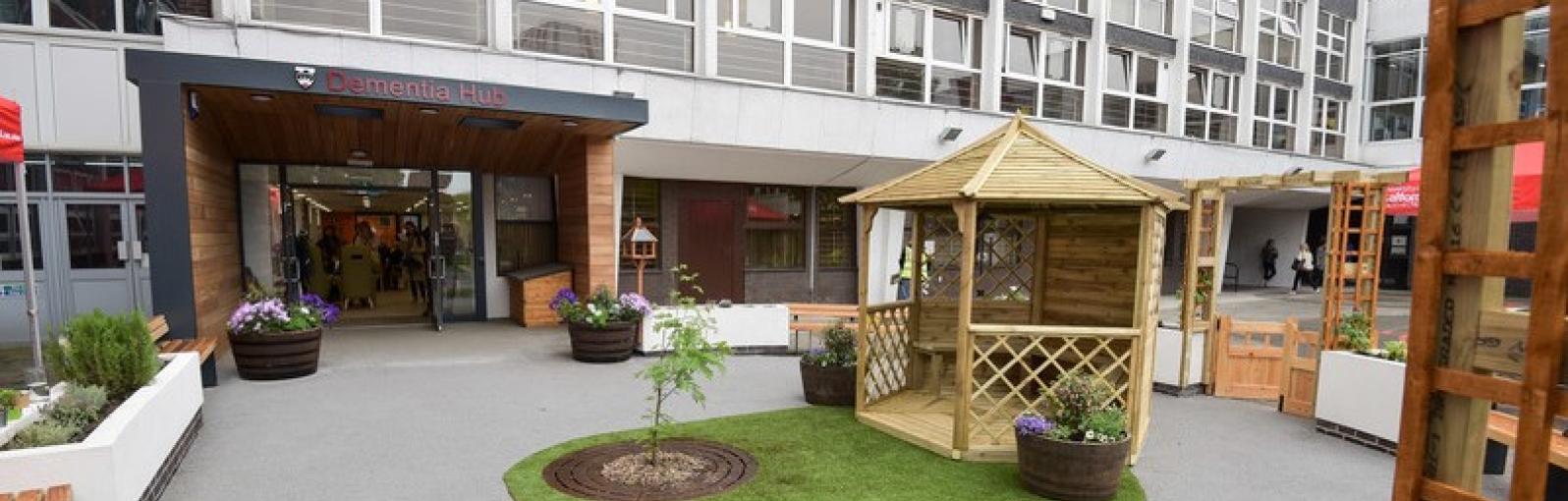 Wooden pagoda and garden in courtyard outside the Dementia Hub entrance