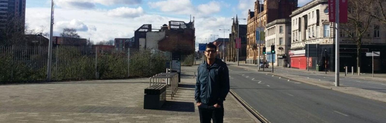 A male student stood on Chapel Street looking into the camera