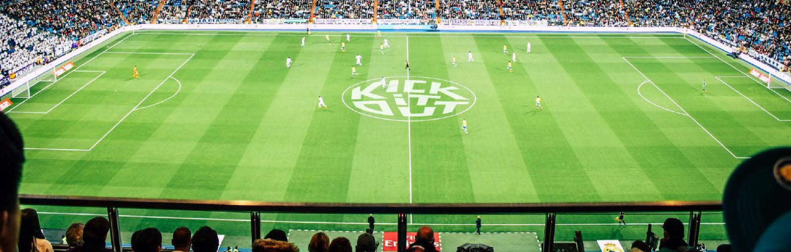 Football pitch with kick it out logo