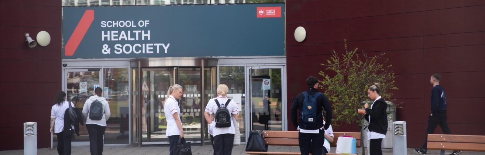 A selection of students chatting in front of our Mary Seacole building