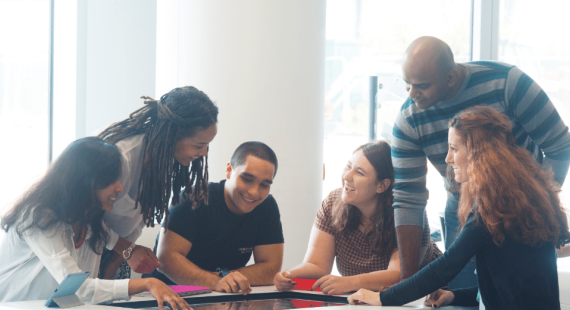 Six business students working together at a table