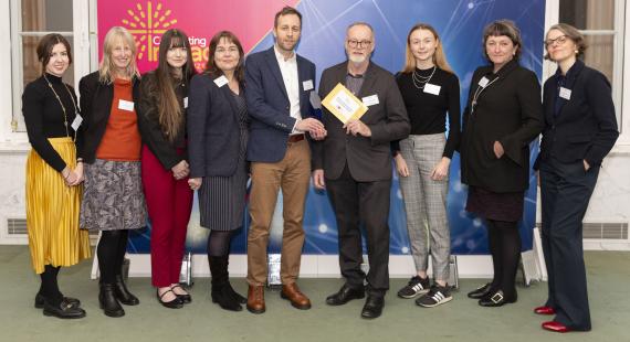 Dr David Frayne being presented with the Celebrating Impact Prize 2024 with other university fellows