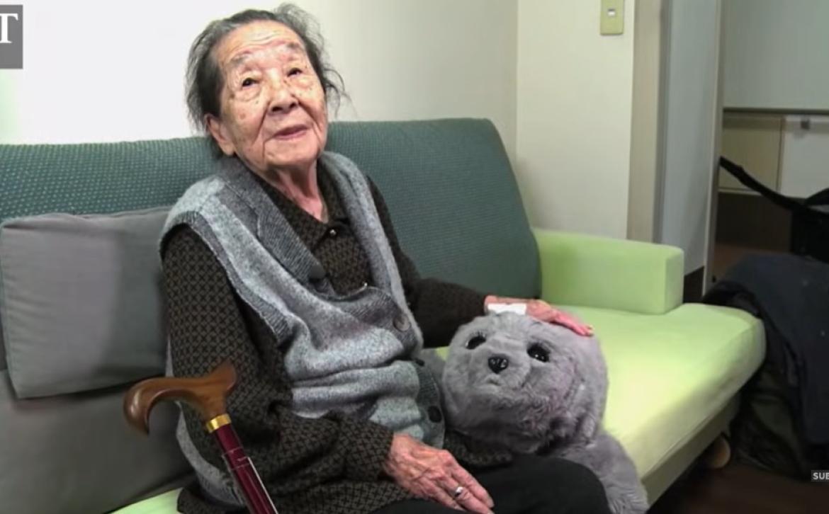 Elderly lady with an AI robot